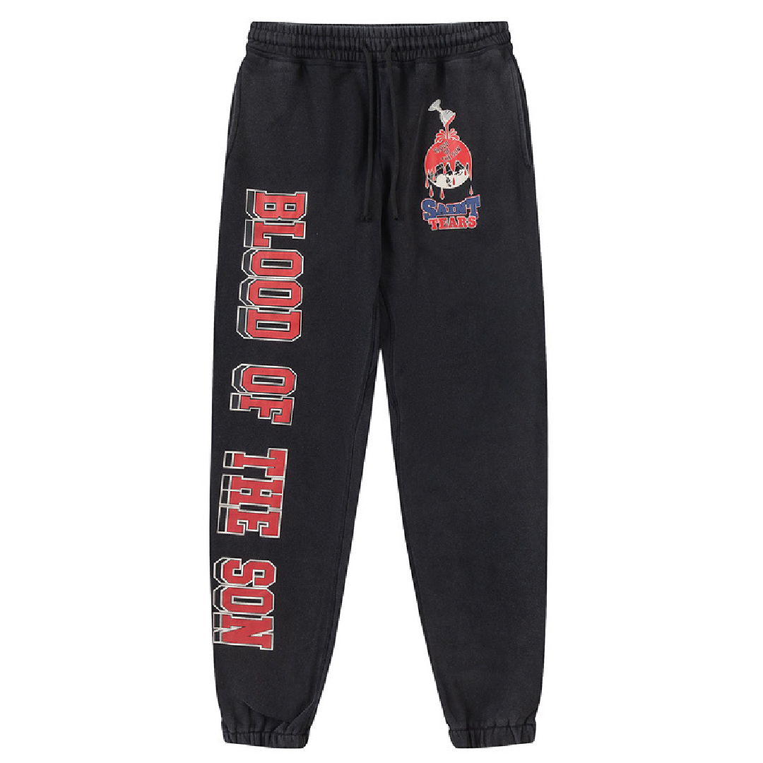 SAINT Mxxxxxx × Denim Tears Holy Grail Graphic Sweatpants – Black front SAINT Mxxxxxx × Denim Tears Holy Grail Graphic Sweatpants – Black - Image 1